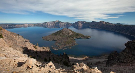 Crater Lake as seen from The Watchman.  Wizard Island, which formed after the caldera collapse, occupies the center of the photo.