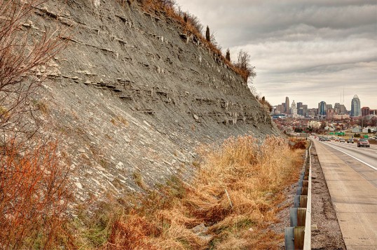 Ordovician shale and limestone along I-75 in northern Kentucky; downtown Cincinnati, Ohio occupies the background