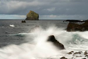 Rocky coastline and breaking wave,  Iceland